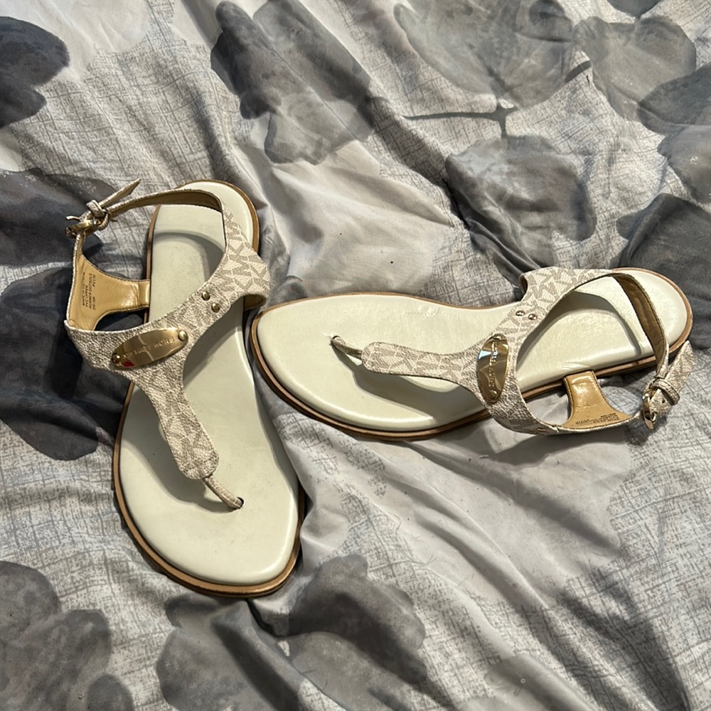 Used Michael kors sandals in excellent condition. White with gold